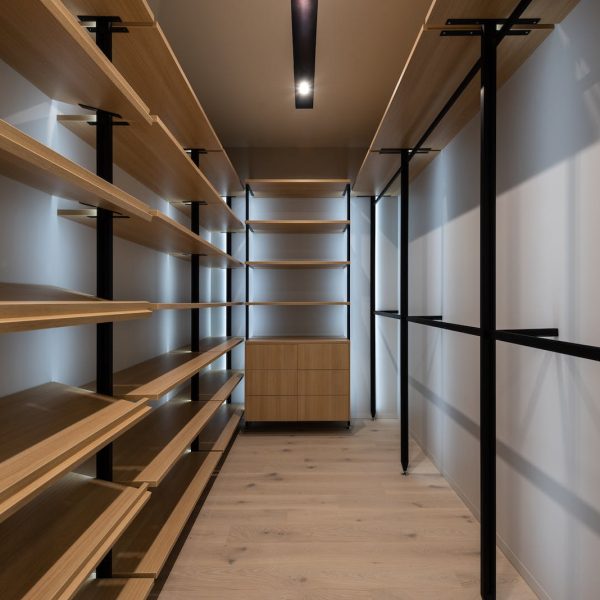 Interior of wardrobe with wooden shelves